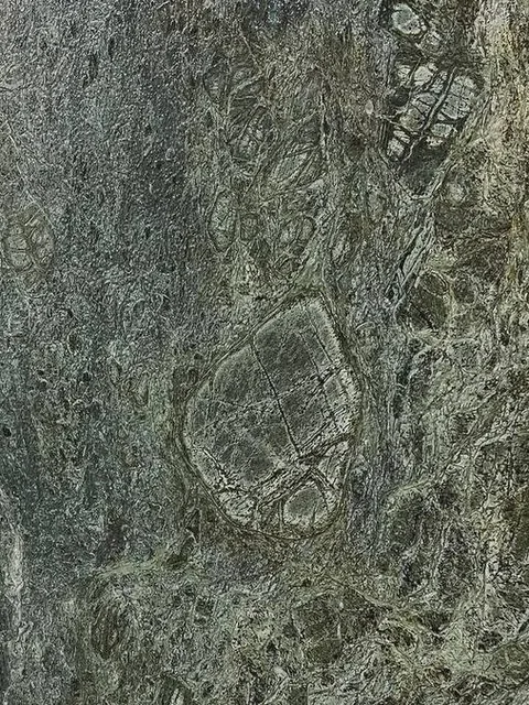 A polished slab of Lagon Green granite in LMC’s yard
